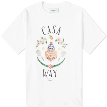 Explore the Casablanca Casa Way T-Shirt, a sporty tee made from organic cotton. This white T-shirt features a lively design depicting a building, flowers, oranges, and tennis rackets. The words "Casa Way" and "Equipment Sportif" beautifully frame the vibrant illustration.