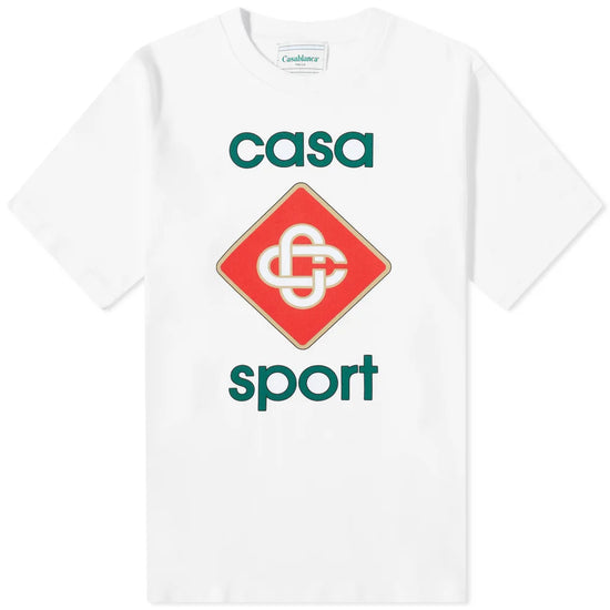 The Casablanca Casa Sport Logo T-Shirt by Casablanca is made from organic cotton, featuring a red diamond intertwined logo and green text reading "casa sport" inspired by African art.