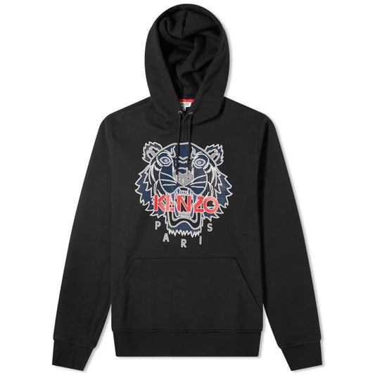 The Kenzo Silicone Scuba Hoodie is a black hoodie that features an embroidered tiger, detailed in blue and white. The name "KENZO" appears in red on the tiger's face, with "PARIS" positioned beneath. This stylish and functional piece includes a front pouch pocket and a drawstring hood.