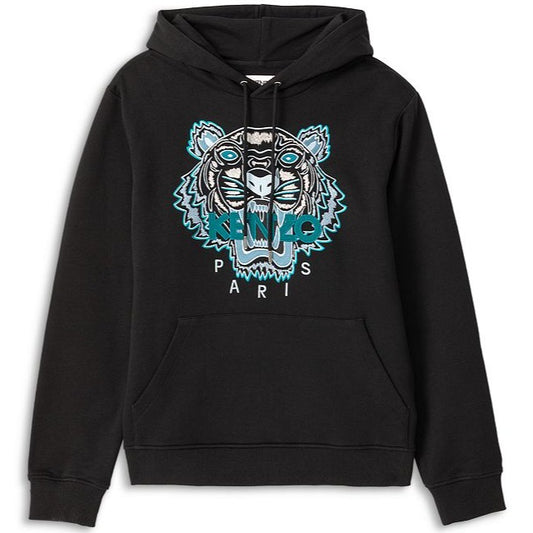 Introducing the Kenzo Classic Tiger Embroidered Hoodie, featuring a bold black design adorned with a striking tiger face in blue and white accents. "KENZO PARIS" is elegantly embroidered below the graphic, combining comfort and style with its long sleeves and convenient kangaroo pouch pocket.