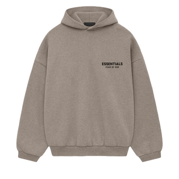 The Fear of God ESSENTIALS HOLIDAY24 Hoodie in Heather Grey features a pouch pocket, "ESSENTIALS" with "FEAR OF GOD" elegantly printed on the left chest, and offers a relaxed fit with ribbed cuffs and hem for effortless style and comfort.