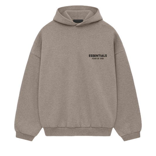 The Fear of God ESSENTIALS HOLIDAY24 Hoodie in Heather Grey features a pouch pocket, "ESSENTIALS" with "FEAR OF GOD" elegantly printed on the left chest, and offers a relaxed fit with ribbed cuffs and hem for effortless style and comfort.