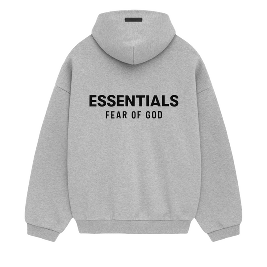 The Fear of God ESSENTIALS HOLIDAY24 Hoodie in Light Heather Grey features "ESSENTIALS FEAR OF GOD" printed on the back. This fleece hoodie includes a drawstring hood and ribbed cuffs, blending style and comfort for modern streetwear enthusiasts.