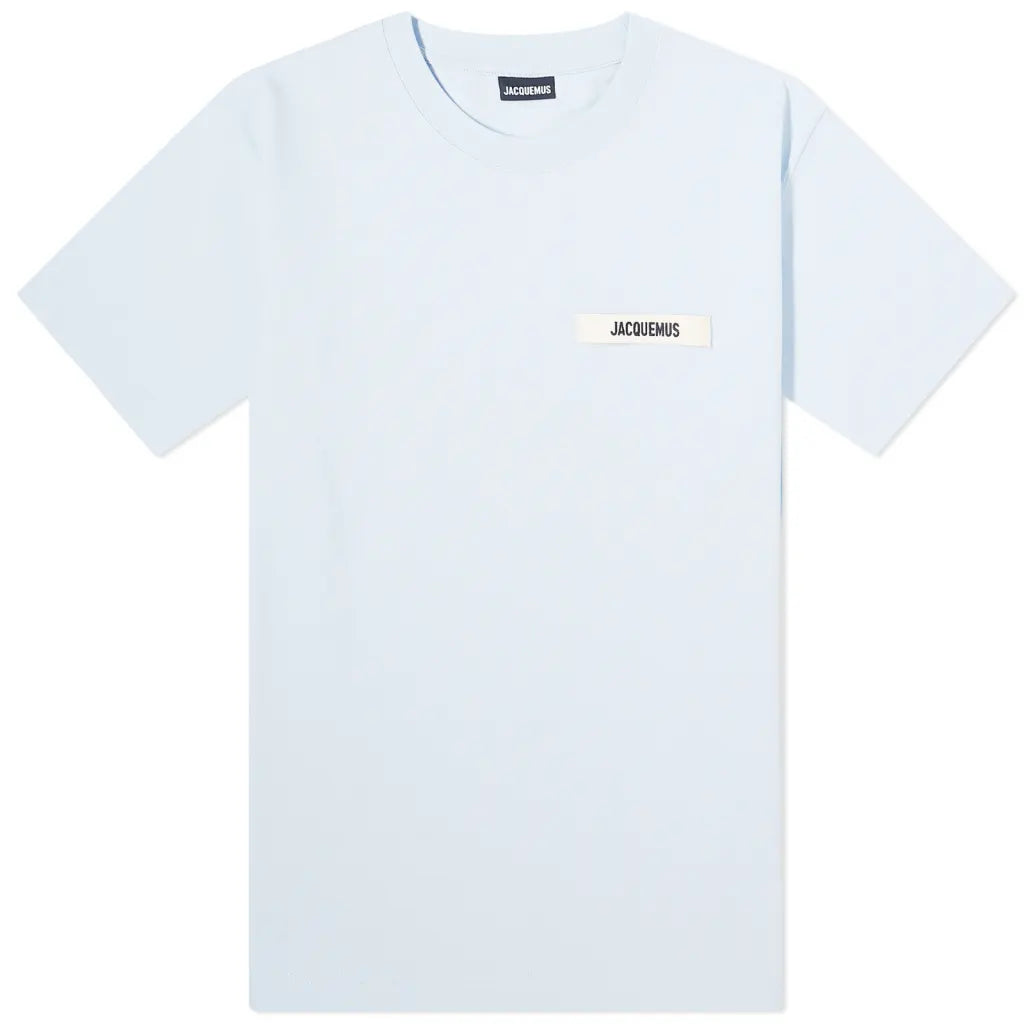 The Jacquemus Gros Grain T-Shirt in black features short sleeves and a small front logo near the neckline, with a minimalist design displayed on a white background.