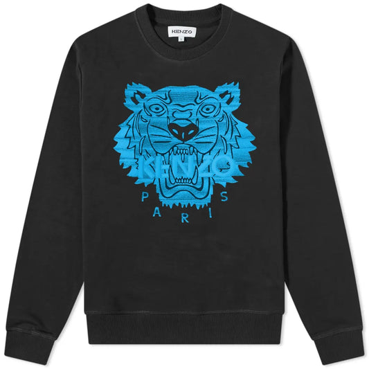 Urban style meets edgy design in the Kenzo Neon Tiger Embroidered Sweatshirt, featuring a vibrant embroidered blue tiger face. This piece is enhanced with the seamlessly integrated "KENZO" and "PARIS" branding within the bold design.