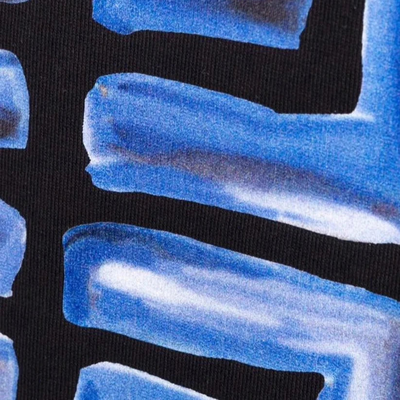 Close-up of abstract blue brushstrokes on a black background, reminiscent of the dynamic patterns found on the Givenchy Paris 4G Logo T-Shirt in Black/Blue. The strokes vary in size and direction, creating a textured pattern with varying shades of blue, as soft cotton merges style with art.