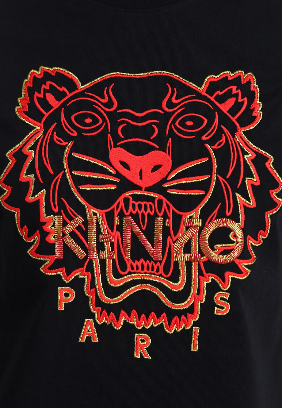 The Kenzo Embroidered Tiger T-Shirt, crafted in Portugal, showcases a vibrant red and orange tiger face with an open mouth, alongside the bold "KENZO PARIS" branding elegantly embroidered beneath the eye-catching design.