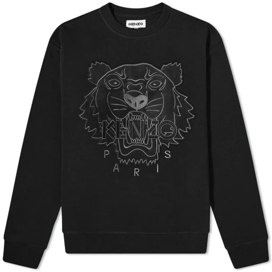 The Kenzo Velvet Tiger Sweatshirt in black highlights a velvet tiger's face on the front, framed by the text "KENZO PARIS" underneath. Crafted from 100% cotton, this fashionable item includes long sleeves and a crew neck.