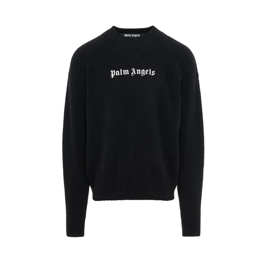 The Palm Angels Classic Wool Logo Sweater features "Palm Angels" in white Gothic-style text on the front. Designed with a simple crew neck and long sleeves, this sweater is crafted from Merino wool and comes in black.