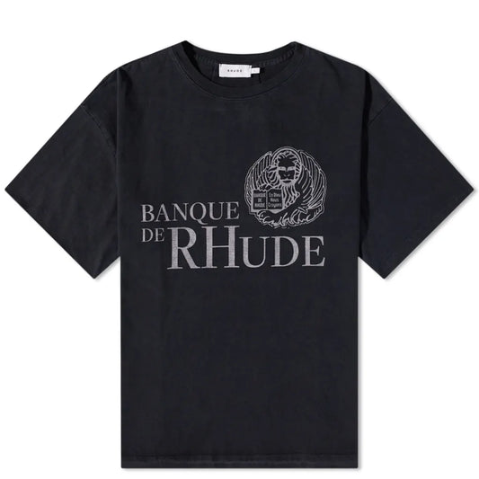 The Rhude Banque De Rhude T-Shirt, by the brand Rhude, is a vintage black piece made from 100% cotton and showcases "BANQUE DE RHUDE" in silver on the front along with a detailed circular emblem.