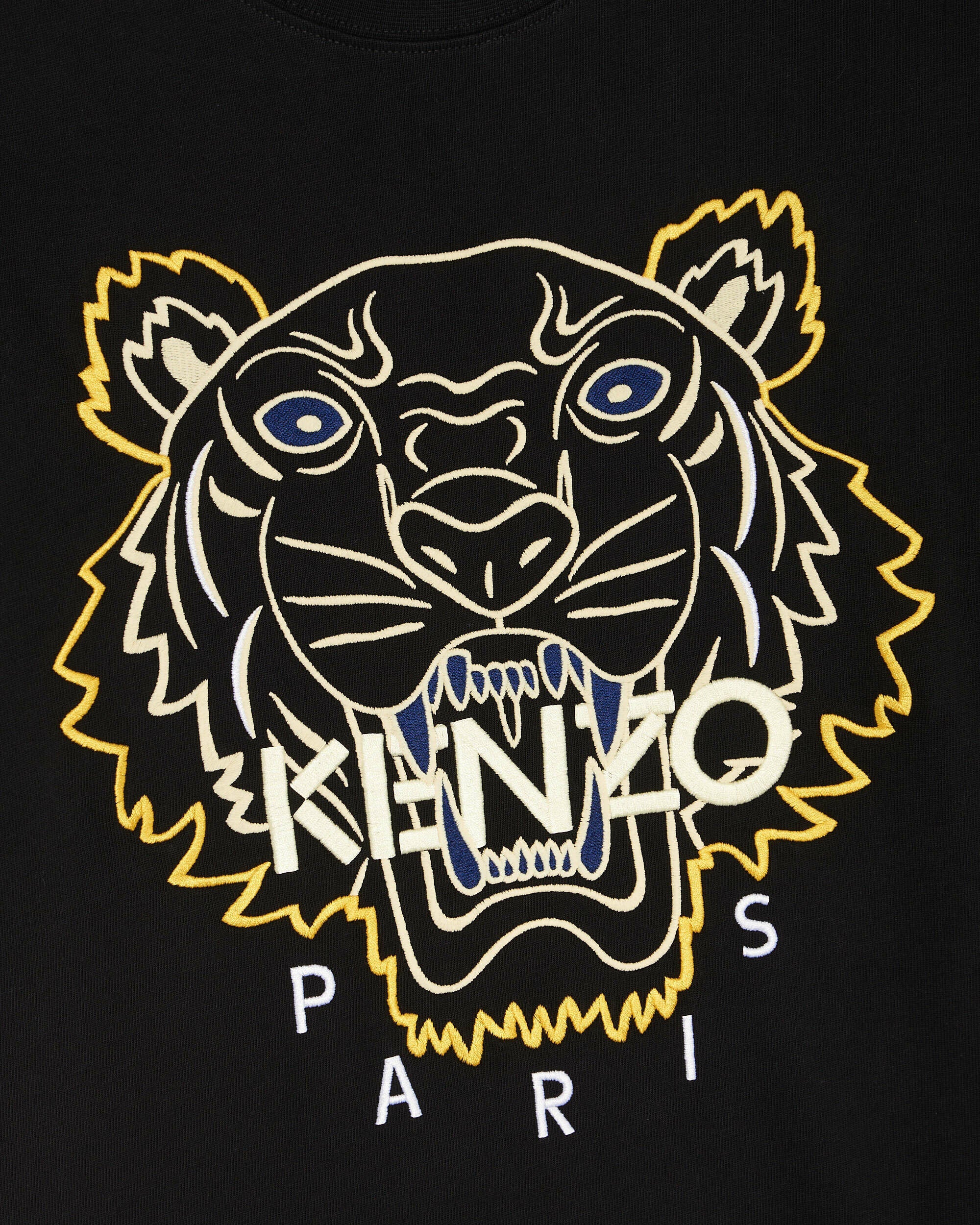 The Kenzo Embroidered Tiger T-Shirt features premium black cotton fabric adorned with a detailed embroidered tiger head in blue and yellow. "Kenzo" is prominently displayed across the tiger's face, with "Paris" elegantly positioned underneath, making this Kenzo piece a standout addition to any wardrobe.
