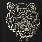 The Kenzo Oversize Embroidered Tiger T-Shirt in black features a premium cotton design with an eye-catching embroidered tiger roaring next to the "Kenzo Paris" logo.
