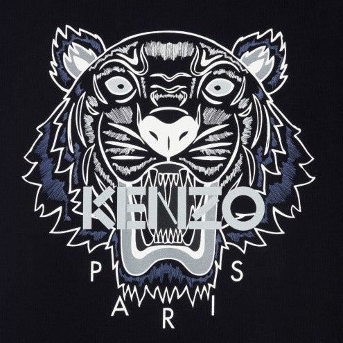 The Kenzo Classic Tiger T-Shirt features an illustrated tiger face in black, white, and blue on a dark background. The word "KENZO" is displayed across the tiger's mouth with "PARIS" underneath, creating a bold and graphic design that stands out beautifully on this premium cotton black tee by Kenzo.
