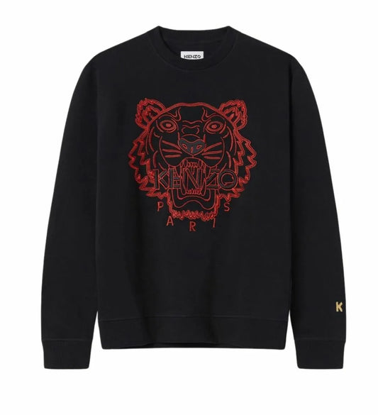 Introducing the Kenzo CNY Tiger Embroidered Sweatshirt in black, featuring a bold red embroidered tiger head as part of the exclusive Chinese New Year collection. The phrase "KENZO PARIS" is elegantly stitched beneath it, with the letter "K" adorning the left sleeve.