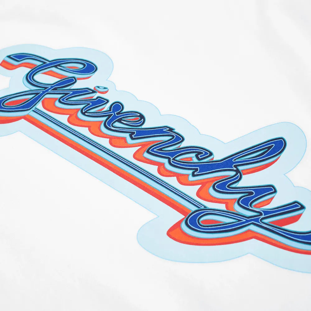 Close-up of a Givenchy logo featured on the pure cotton jersey of the Givenchy Paris Retro Logo T-Shirt in white. The design showcases stylized cursive lettering in blue and red set against a light blue background, capturing an essence of both elegance and comfort.