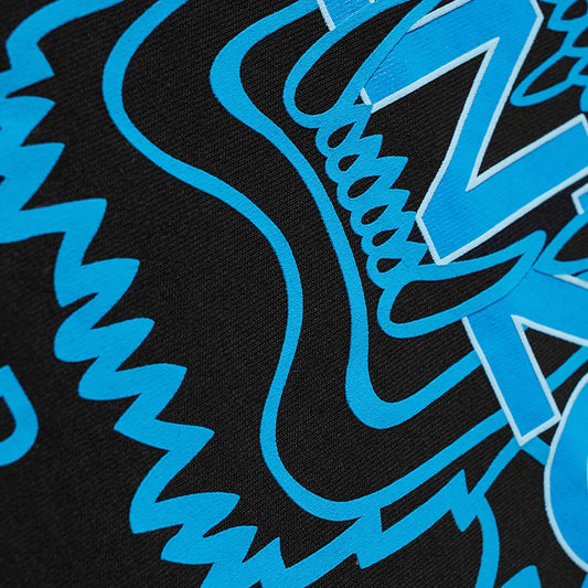 Take a close look at the vibrant black fabric of the Kenzo Neon Classic Tiger Print T-Shirt, which features bold blue graphic designs. Made from premium cotton, this iconic tee showcases abstract zigzag and wavy lines intertwined with large blue letters, creating a dynamic and energetic visual reminiscent of Kenzo's signature tiger style.