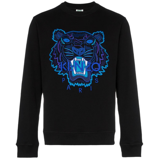 Perfect for your winter wardrobe, the Kenzo Holiday Capsule Embroidered Sweatshirt comes in black and showcases a vibrant graphic of a roaring tiger on the front. The illustration is outlined in blue and purple, featuring "KENZO" across its mouth and "PARIS" below in bold blue letters, highlighting the distinctive embroidered branding from Kenzo.